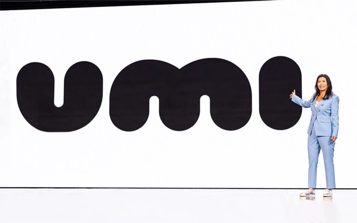 The Umi logo on the CES 2025 keynote stage with a presenter beside it
